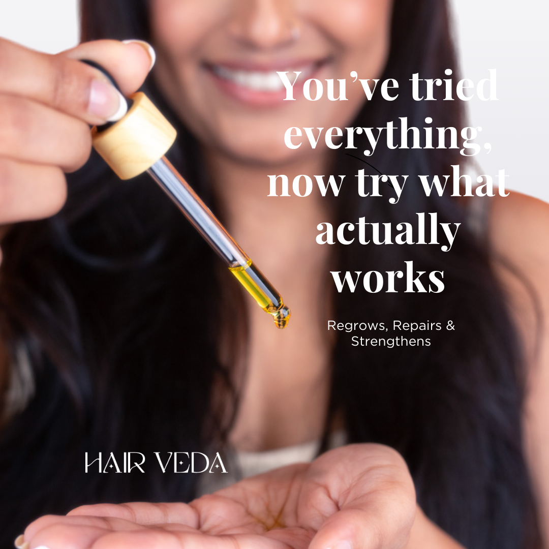 A woman showcases a bottle of oil labeled "You've tried everything, now try what actually works," with hair clips in view.