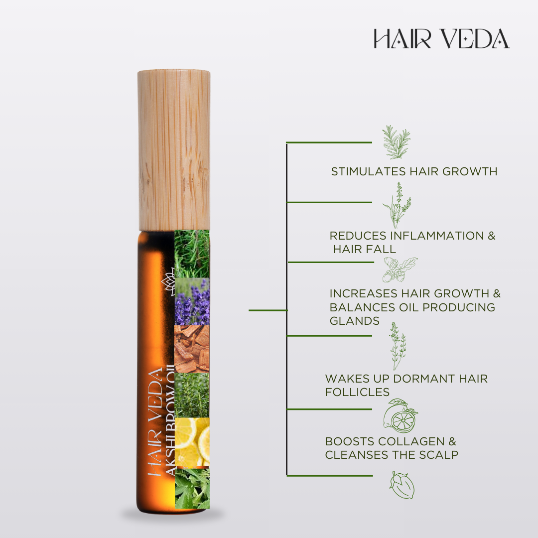 Hair Veda hair oil bottle with visible natural ingredients displayed around it on a wooden surface.