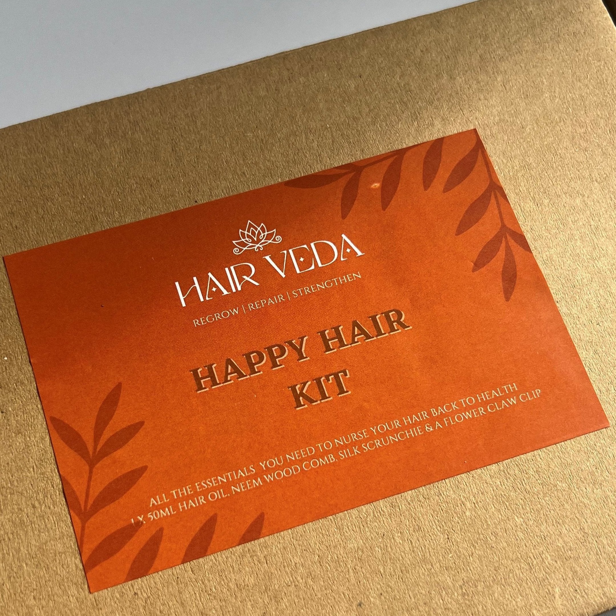 Display of Hair Veda's Happy Hair Kit, featuring various hair care items for nourishing and revitalizing hair.