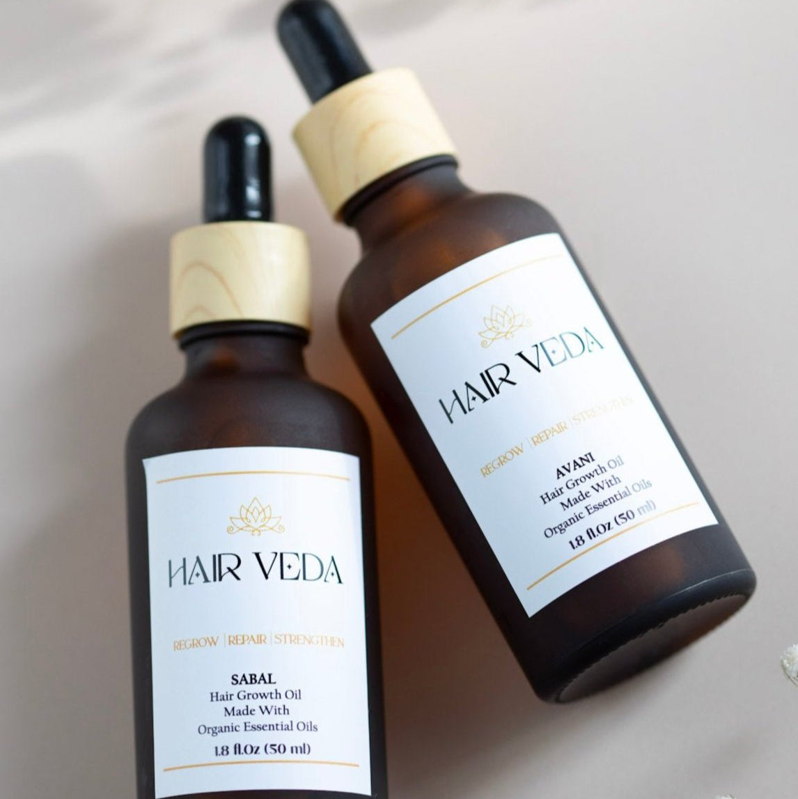 A bottle of Hair Veda hair oil, emphasizing its nourishing properties for revitalizing and strengthening hair.